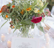 Colourful table centrepiece with flowers